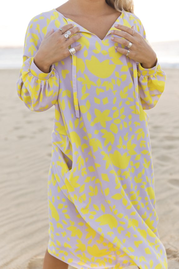 https://www.seamehappy.be/wp-content/uploads/2019/04/Sea-Me-Happy-Noosa-Dress-flowers-yellow-purple-3.jpg