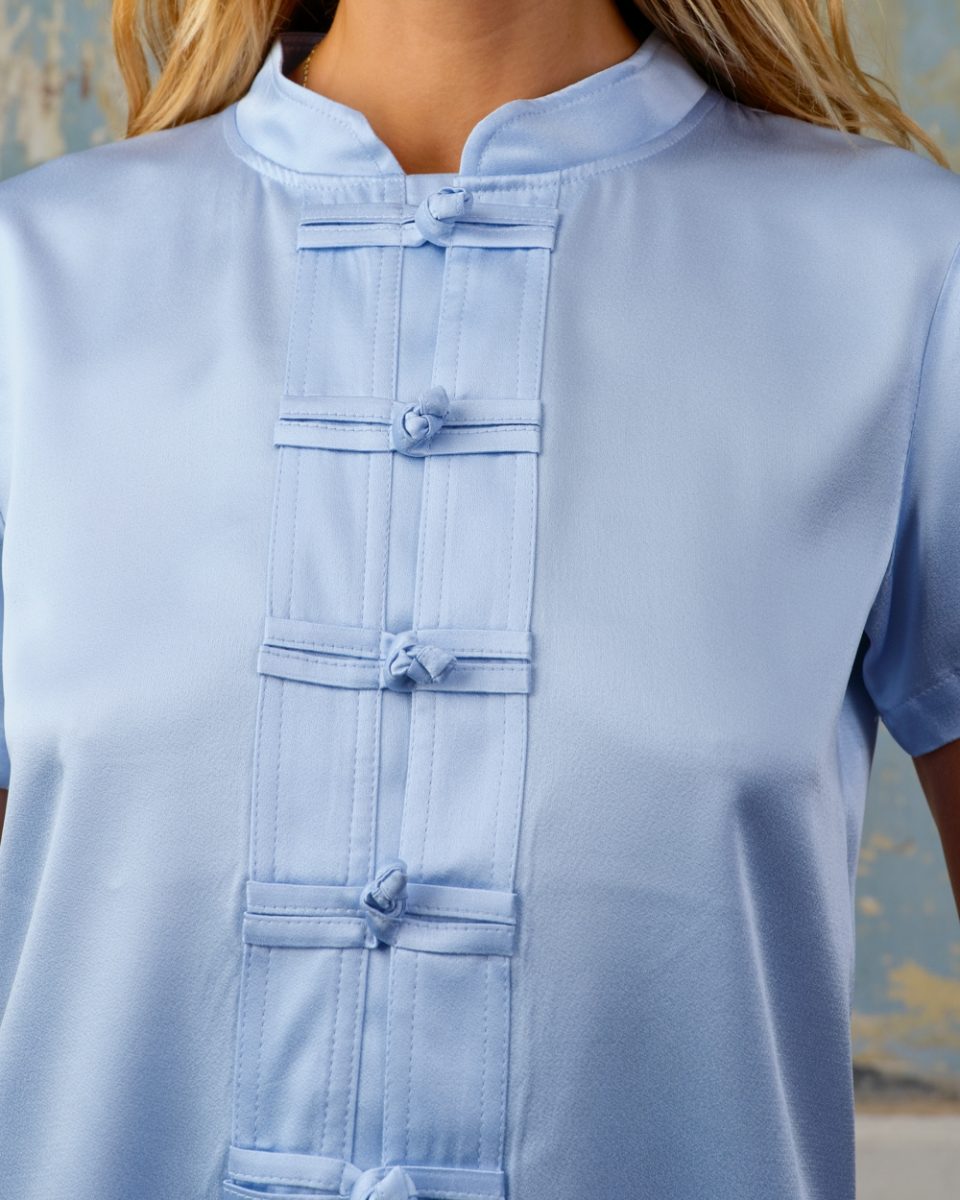 https://www.seamehappy.be/wp-content/uploads/2026/01/Sea-Me-Happy-Lotus-Top-Satin-Crepe-light-blue-detail-9196-960x1200.jpg