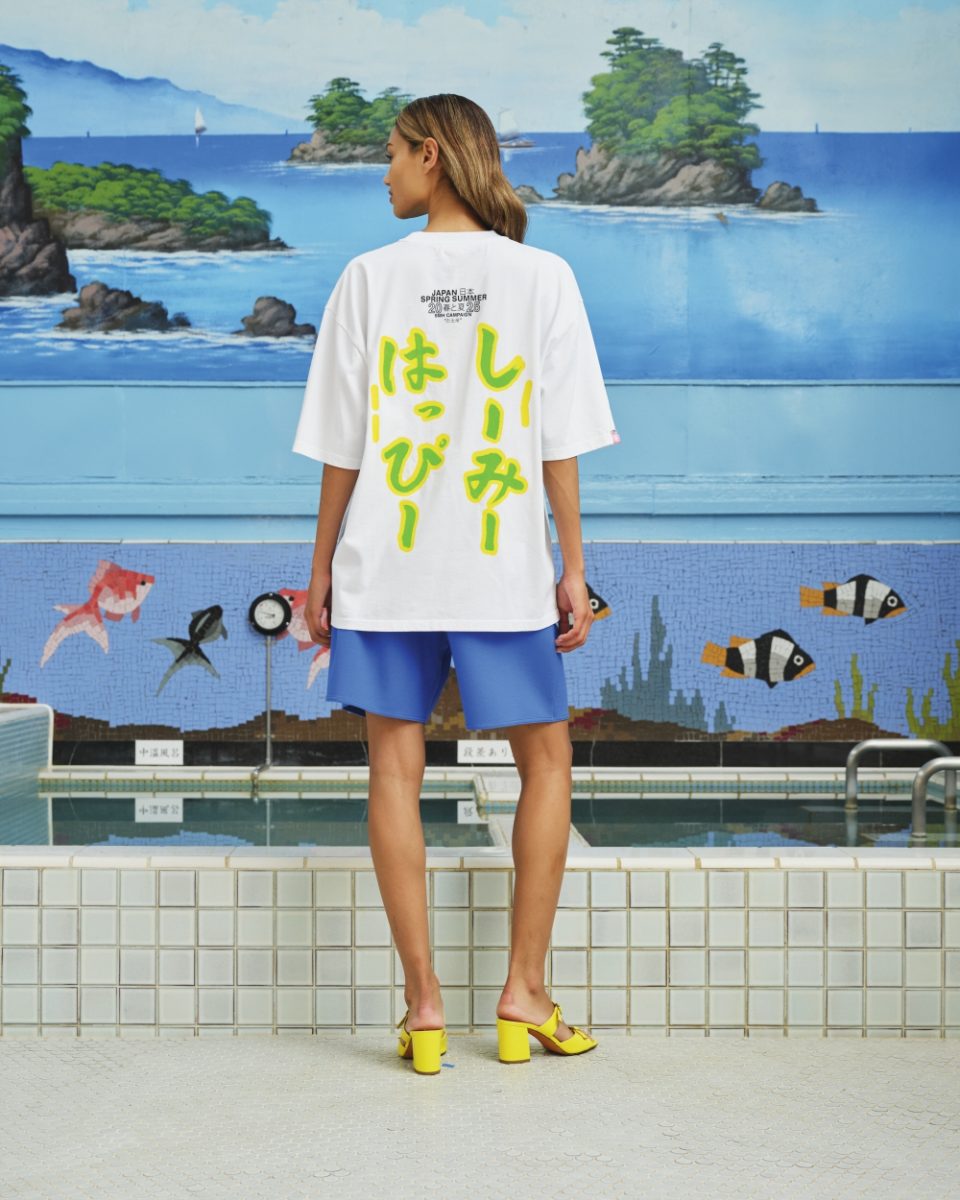 https://www.seamehappy.be/wp-content/uploads/2026/06/Sea-me-Happy-Campaign-T-Shirt-SMH-orange-back-8189-960x1200.jpg